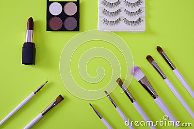 Top view of womenâ€™s cosmetic on neon green background Stock Photo